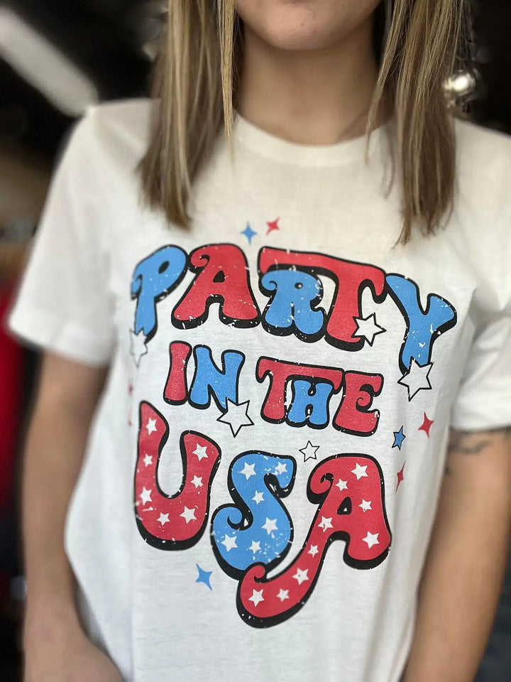 Party in the USA This tee is giving us all the retro vibes!! The graphic is so adorable and perfect for the 4th of July! Model is wearing size Small, her true size $34.99 to $34.99