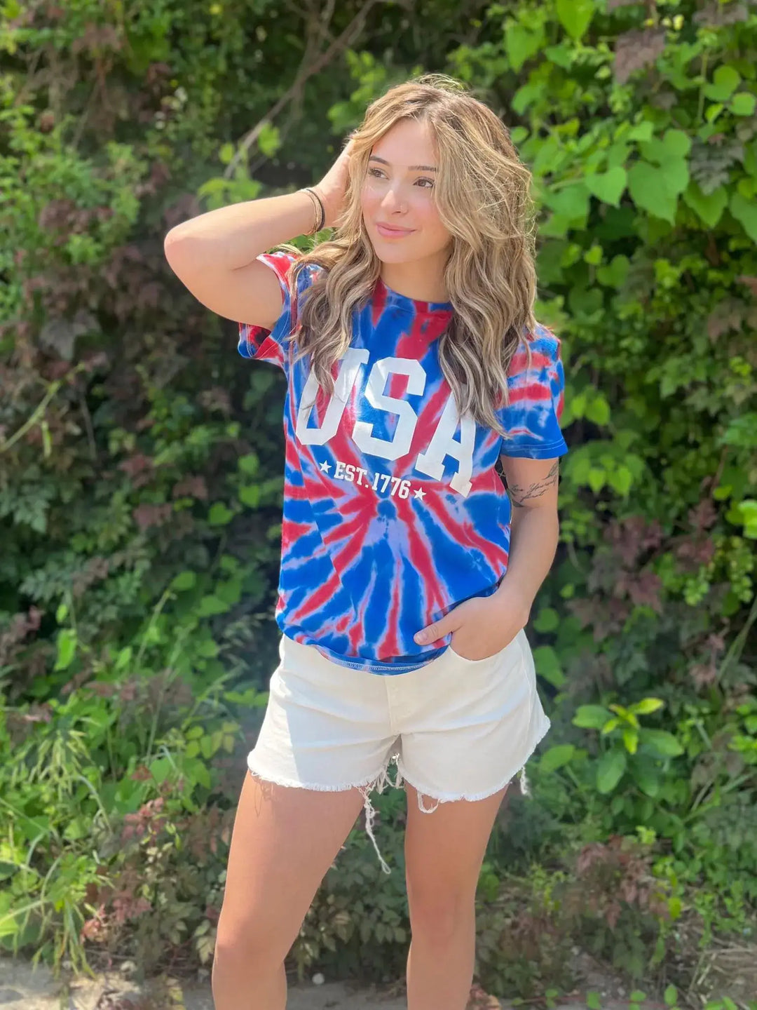 Tie Dye USA Tee Okay, we really did something with this one! Rock the Fourth Of July cookout (or anywhere else really) in this stunning tie dye tee! Model is wearing a size Small, her true size. $35.0 to $35.0